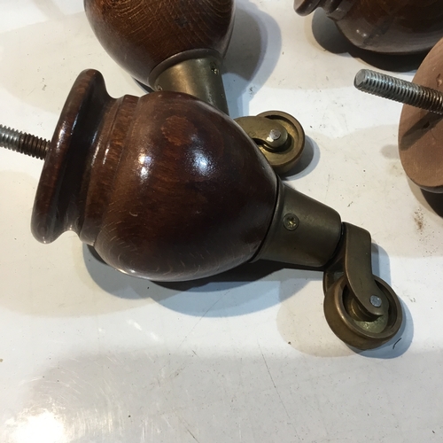 188 - Set of 4 wood and brass based castors