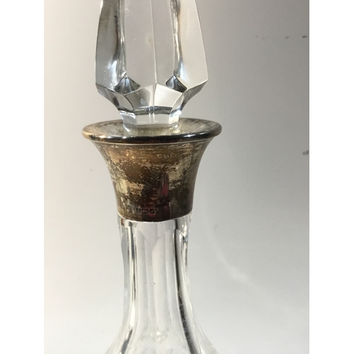 216 - Cut glass decanter with sterling silver collar