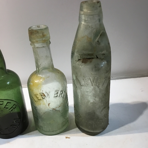 234 - Set of 4 vintage glass bottles inc Harper Boston, Horncastle & Hundelby