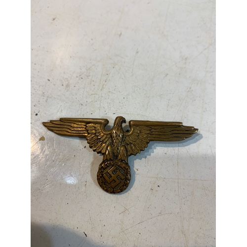 304 - WWII German cap badge with Swastika