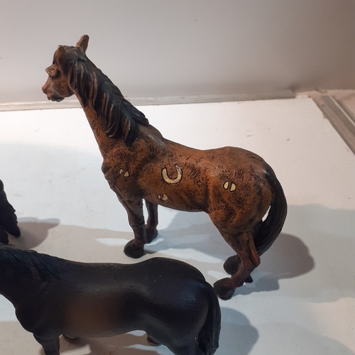 4 - Group of resin/moulded horse figures. Nice condition. Branded on the underside as shown in pictures.... 