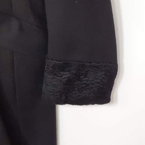 1 - Full length black woollen coat with faux fur trim. Labelled size 14 by Chanelle in good clean condit... 