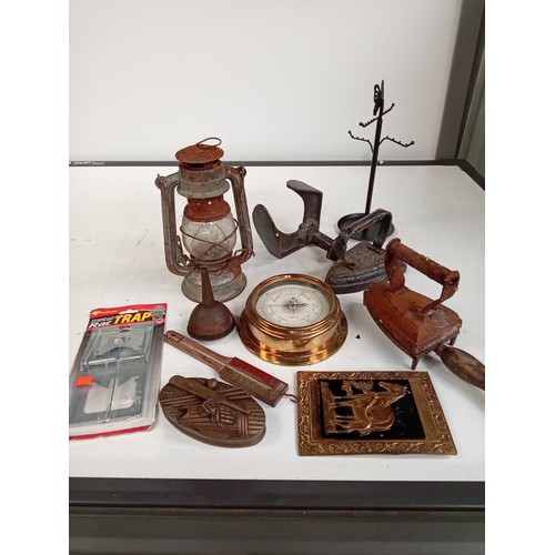 331 - Metal collectible lot including flat irons, Brass barometer, West German metal lamp, mouse trap, sho... 