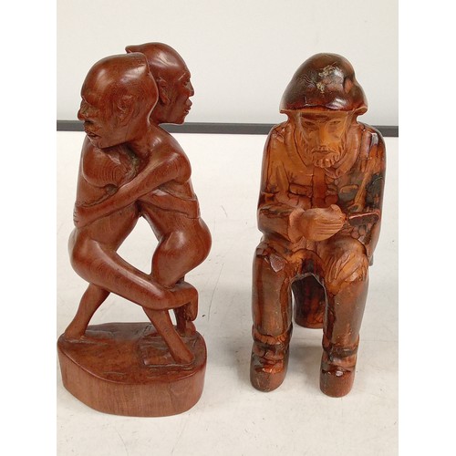 303 - 2 wooden ornaments. A man and an embracing pair, these are in solid wood with a very eye-catching de... 