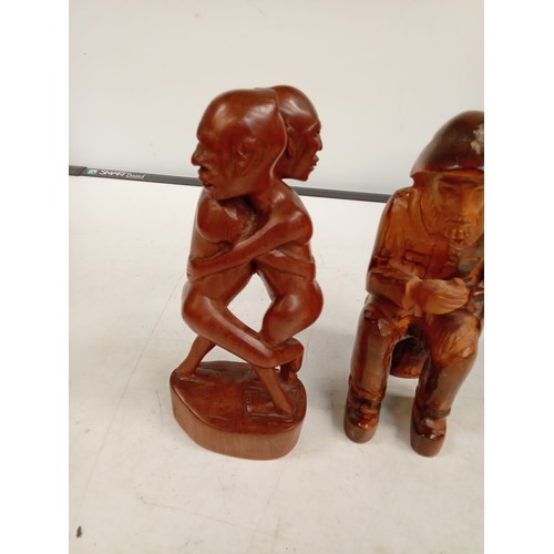 303 - 2 wooden ornaments. A man and an embracing pair, these are in solid wood with a very eye-catching de... 