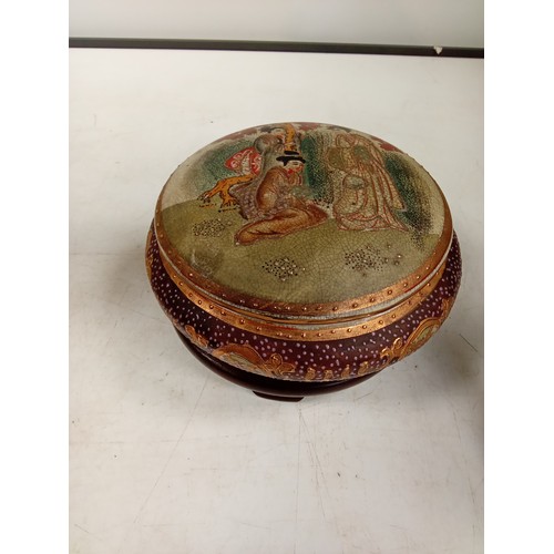 305 - Japanese oriental design lidded pot on dark wood stand. Stamped with an Eastern stamp underneath, th... 