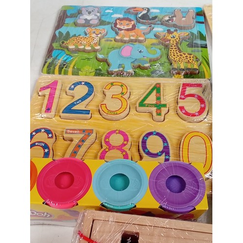 352 - Variety of children's wooden and other  learning toys in mostly as new condition with some read Puff... 