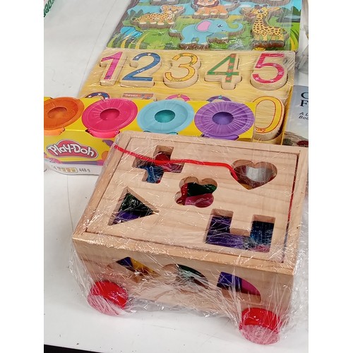 352 - Variety of children's wooden and other  learning toys in mostly as new condition with some read Puff... 