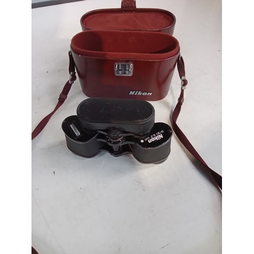 245 - Nikon 8x30 binoculars in case. Serviceable but some wear