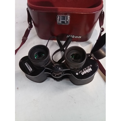 245 - Nikon 8x30 binoculars in case. Serviceable but some wear