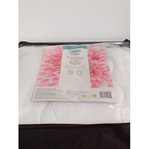 250 - Double bed mattress topper in bag. Good clean condition, looks unused