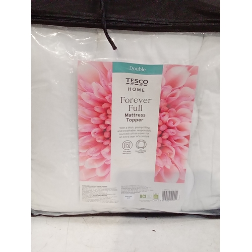 250 - Double bed mattress topper in bag. Good clean condition, looks unused