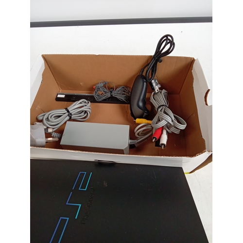 402 - Mixed gaming consoles. PS2, PS1, Wii etc. Some accessories