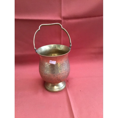 31 - Solid brass ice bucket with decorative carved detail