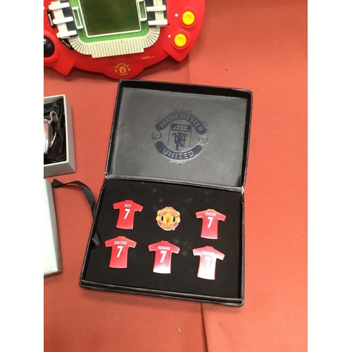 35 - Manchester United memorabilia inc Tiger handheld game, miniature trophy & pin badges