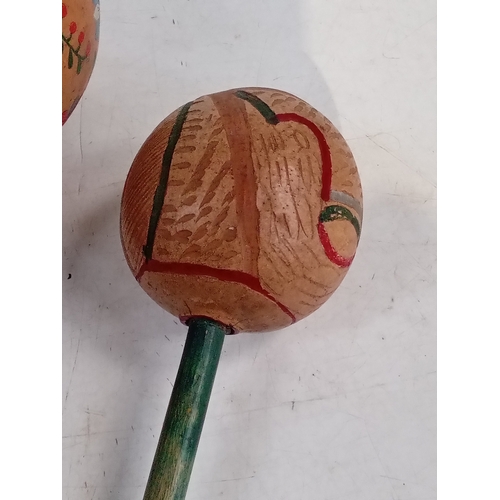 254 - 3 maracas. One pair smaller than a single large one. Look hand painted with great detail