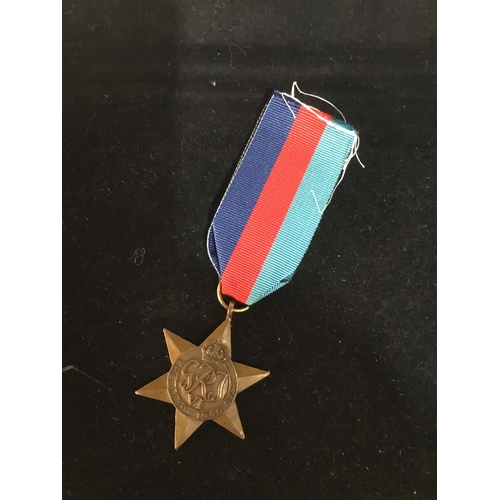 65 - WWII 1939-45 bronze star with ribbon - un-named as issued