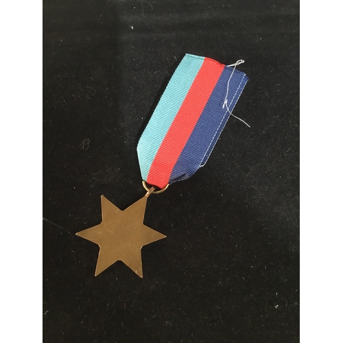 65 - WWII 1939-45 bronze star with ribbon - un-named as issued