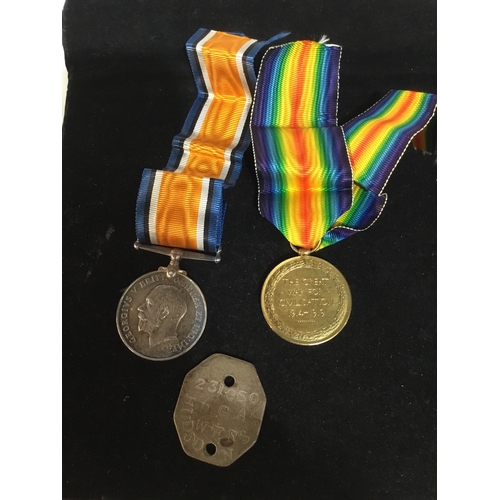 68 - Defence and victory WWII medals with original dog tag also - issued to 175038 GNR F J Hudson