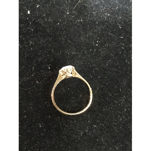 76 - 9ct gold ring with clear stone - size 52 - 1.64g