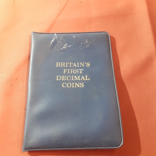 477 - Wallet containing Britain's first decimal coins