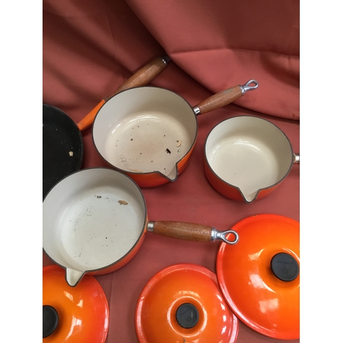 40 - Le Creuset burnt orange cast iron set of pan inc number 16, 18 & 20 saucepans & frying pan 26