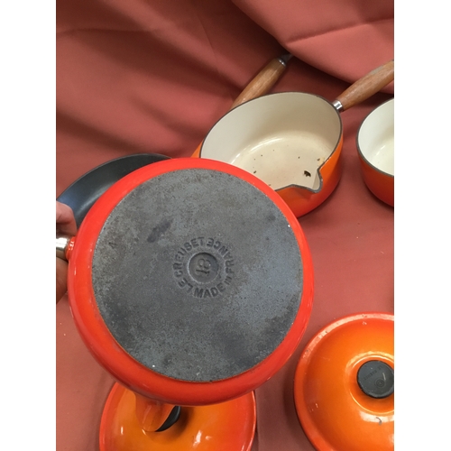 40 - Le Creuset burnt orange cast iron set of pan inc number 16, 18 & 20 saucepans & frying pan 26