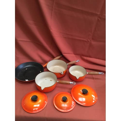 40 - Le Creuset burnt orange cast iron set of pan inc number 16, 18 & 20 saucepans & frying pan 26