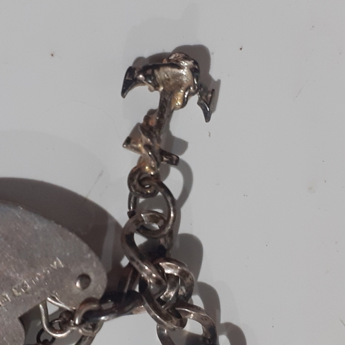 53B - Sterling silver padlock charm bracelet with 2 charms. Clasp works fine. Wood benefit a clean.  Weigh... 