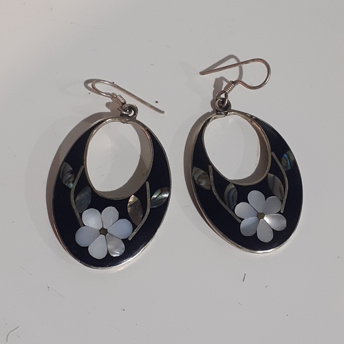 54B - Pair of Mexican silver oval shaped earrings with mother of pearl effect flower design. Very eye-catc... 