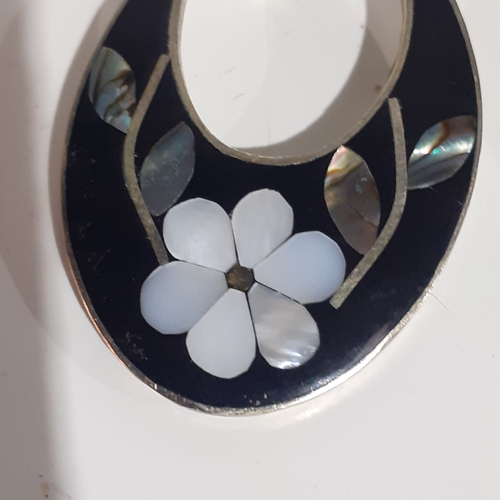 54B - Pair of Mexican silver oval shaped earrings with mother of pearl effect flower design. Very eye-catc... 
