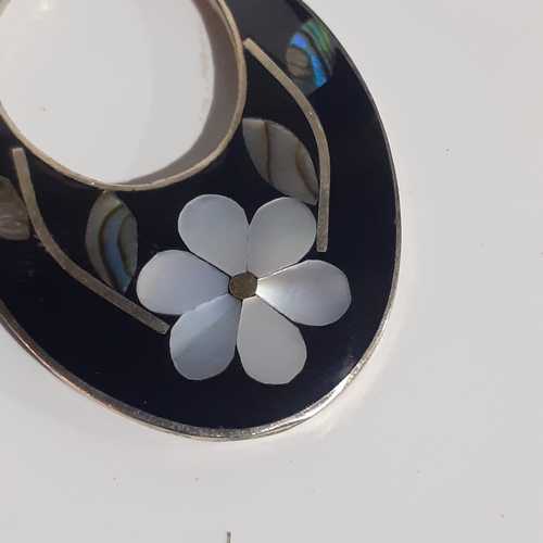 54B - Pair of Mexican silver oval shaped earrings with mother of pearl effect flower design. Very eye-catc... 