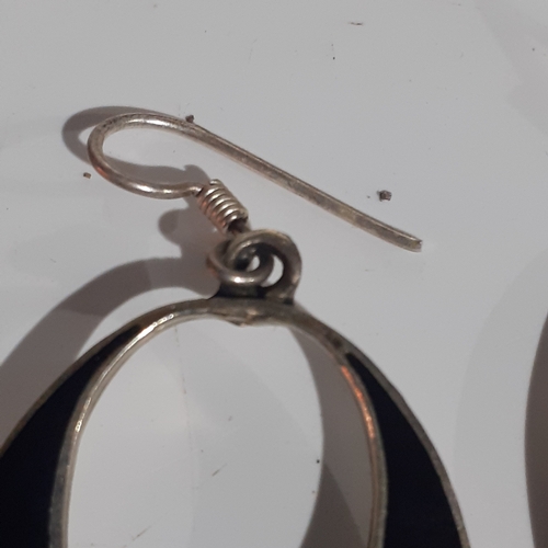 54B - Pair of Mexican silver oval shaped earrings with mother of pearl effect flower design. Very eye-catc... 