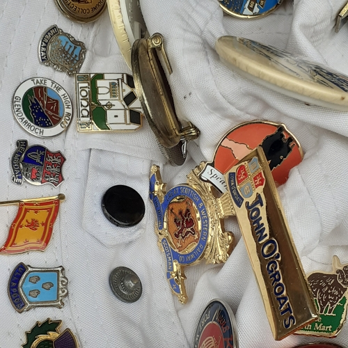 16 - 2 hats with one and a bit covered in various collections pin badges. Lots travel related in overall ... 