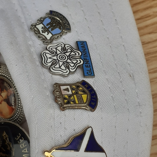 16 - 2 hats with one and a bit covered in various collections pin badges. Lots travel related in overall ... 