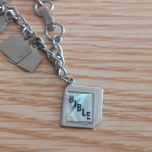 2 - An eye-catching wooden trinket box containing a number of religious related jewellery items includin... 