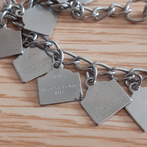 2 - An eye-catching wooden trinket box containing a number of religious related jewellery items includin... 