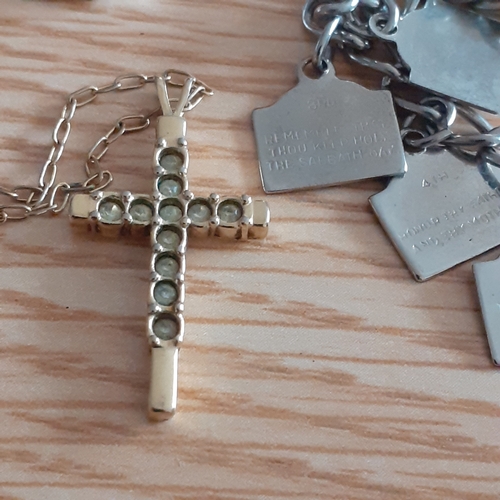 2 - An eye-catching wooden trinket box containing a number of religious related jewellery items includin... 