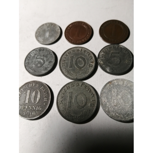 21A - COINS : GERMANY 9 WWl and WWII coins Many with swastika on the reverse