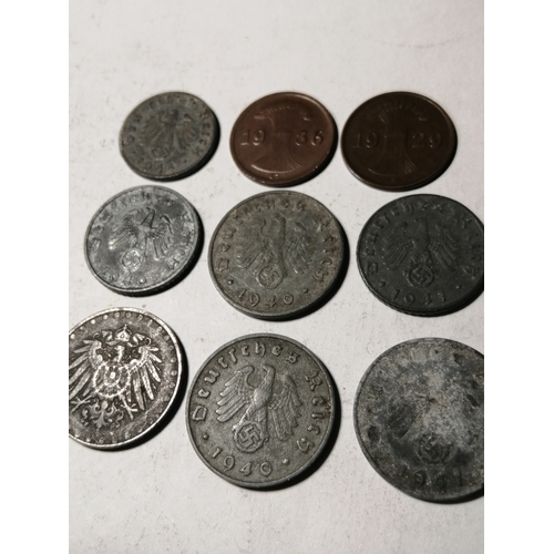 21A - COINS : GERMANY 9 WWl and WWII coins Many with swastika on the reverse