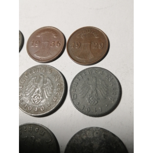 21A - COINS : GERMANY 9 WWl and WWII coins Many with swastika on the reverse