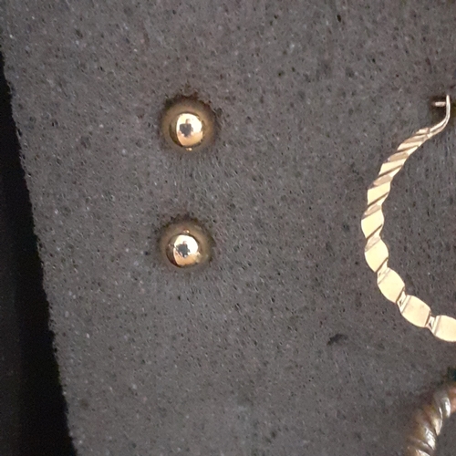 5 - Several pairs of gold coloured metal earrings. Mostly drop hoops with one pair of studs. Nice condit... 