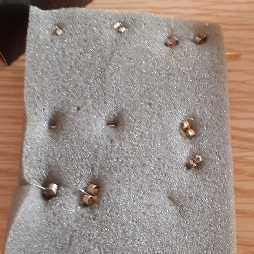 5 - Several pairs of gold coloured metal earrings. Mostly drop hoops with one pair of studs. Nice condit... 