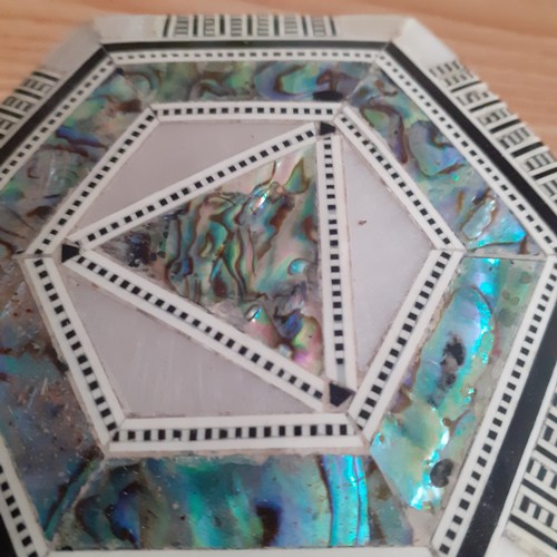 2 - An eye-catching wooden trinket box containing a number of religious related jewellery items includin... 