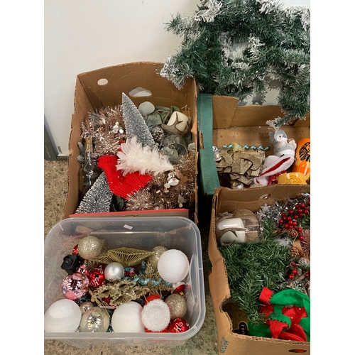 169 - Four boxes of Christmas decorations inc baubles, garland and more