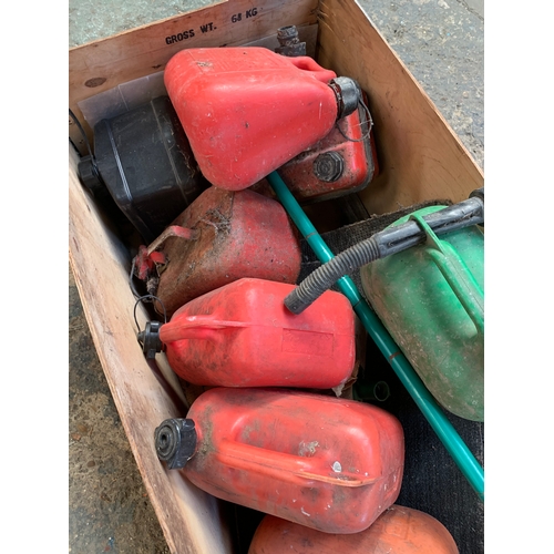 176 - Large wooden crate full of plastic & metal small Jerry cans