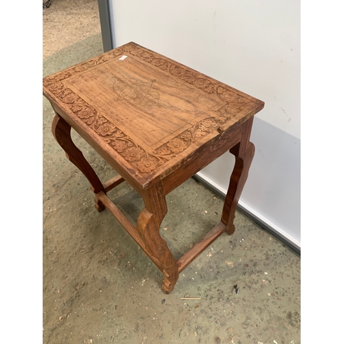 225 - Small ornately carved wooden side coffee table