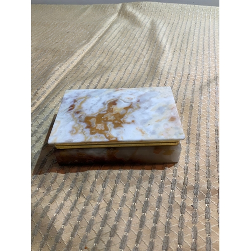 110 - Onyx/ marble trinket box with contents of costume jewellery