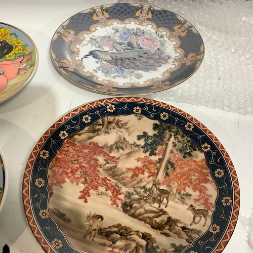 252 - Two Chinese Cabinet plates Deer and Peacock and a pair of Cats & Dogs scene plates in Spring and Aut... 