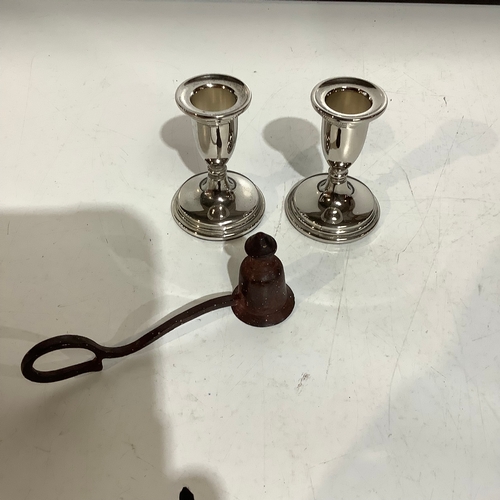 256 - Vintage cast iron candle snuffer with finger ring and a pair of silver plated candlesticks